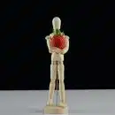 brown wooden figurine with red roses